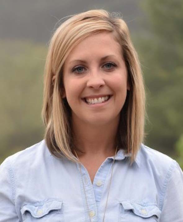 Wall Residences Residential Regional Director Candice Bowman standing outside