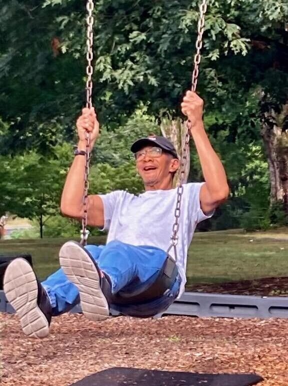 Supported Living individual on swing